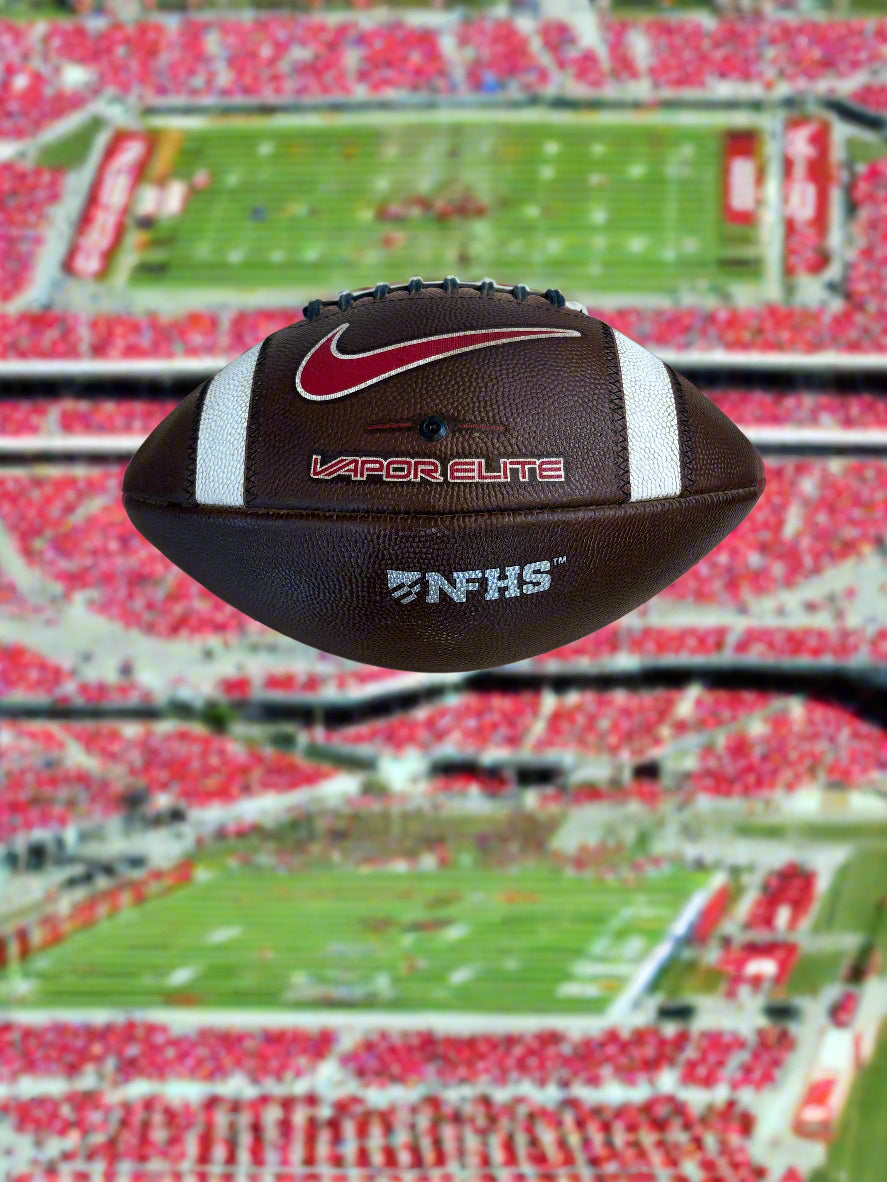 Football with Nike and NFL logos on a tiled floor